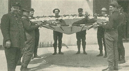 (3) Instructor McAdam (left) and men in jumping-net practice. (Photos 2 and 3 courtesy of the New York Tribune.)