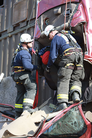 (6) Members harness the second victim for removal from the vehicle.