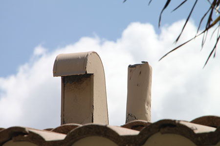 (3) Vents above a laundry room, including a soil vent pipe on the right. 