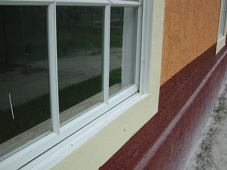 (8) Flush windows are typically indicative of frame construction.