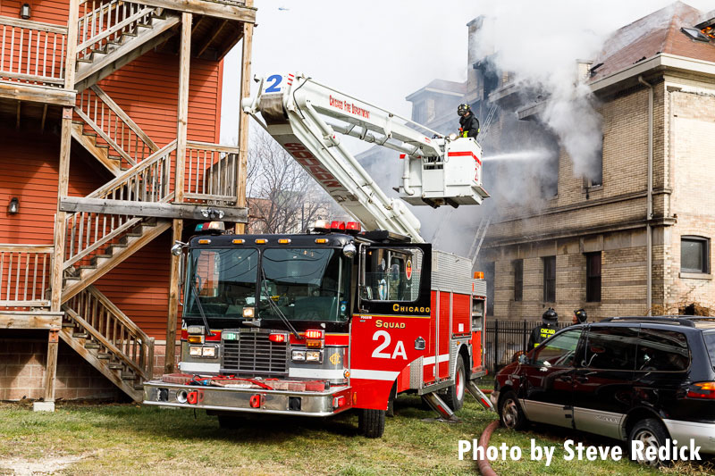 Fire apparatus positioned at the scene of a 2-11 alarm in Chicago.