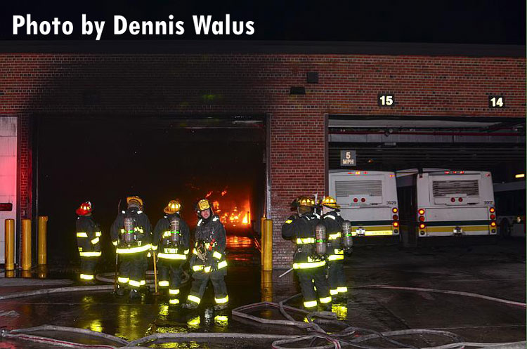 Firefighters with lines at the scene of a fire in a bus terminal in Detroit.