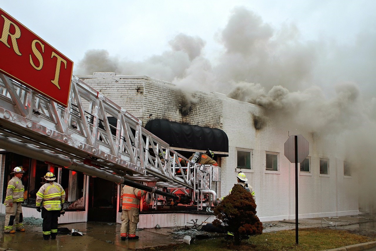 Firefighters work at the scene of a fire in a bridal shop in Elmhurst, Illinois.