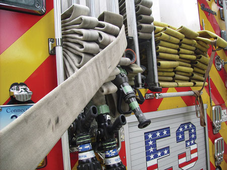 (<b>11)</b> When deploying the leader line, you must pull it completely clear of the hosebed. Otherwise, it can obstruct the other hose loads and interfere when you are attempting to lay the five-inch hose to a hydrant.