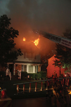 (5) Lightning struck a home’s chimney, and the attic quickly became involved in fire. <i>[Photos 5-9 by Rayford Smith, Virginia Beach (VA) Fire Department Multi-Media Unit.] </i>