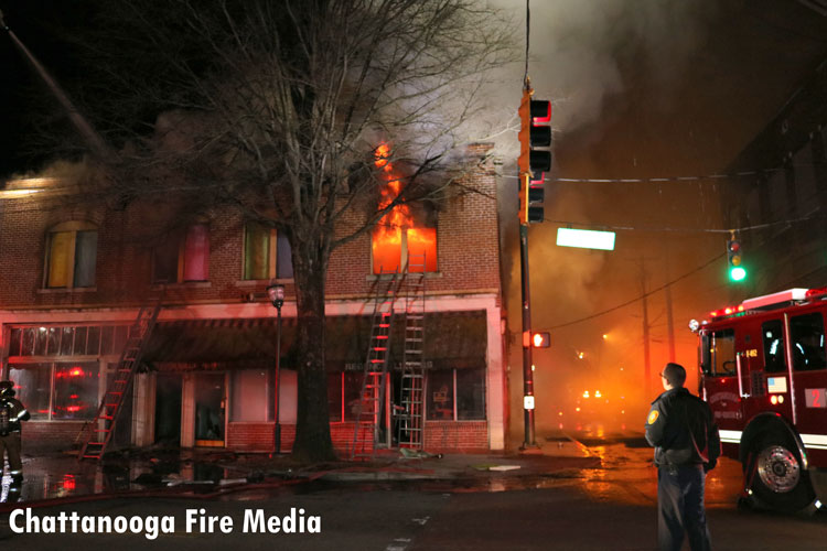 Flames roar from the windows of a two-story building in downtown Chattanooga.