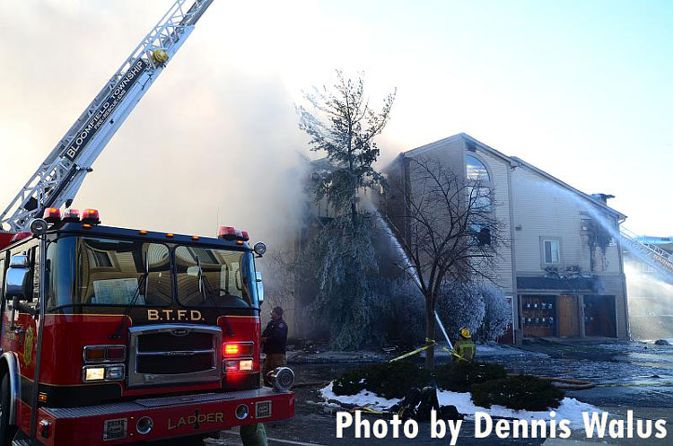 Firefighters at the scene of an apartment building fire in Southfield, Michigan.