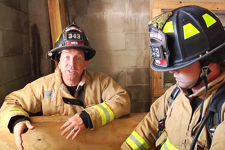 Paulie Capo and another firefighter on down firefighter rescue.