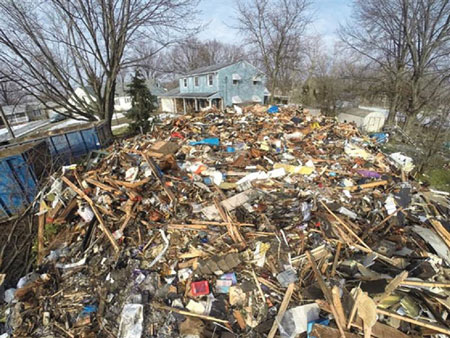 (4) Hoarding conditions can catch us. Prepare, anticipate, and react accordingly. This is what was left of a serious hoarding fire in my town. Twenty yard dumpsters were needed to haul away a 1,500-square-foot dwelling. <i>(Photo courtesy of Elyria Chronicle Telegram.)</i>