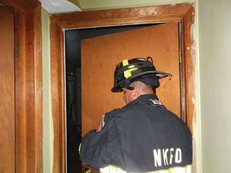 (1) A typical hinge installation for six screw hinges: 1⁄2-inch screws, three per leaf, secure the hinge to the door and the frame. Heavy exterior doors use three hinges with eight screws, four per leaf. (Photos by author.) (2) The door is not locked but hits an obstruction, not opening enough to allow personnel to enter the room.