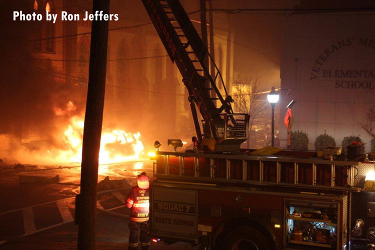 Flames engulf a vehicle during a multi-alarm fire in Union City, New Jersey.