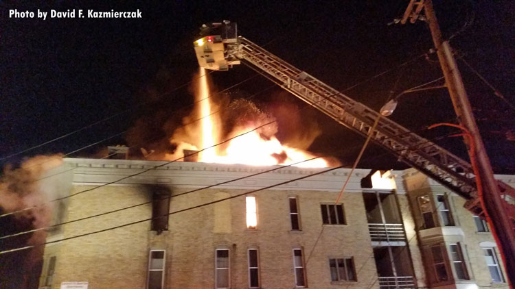 Aerial device pours water on apartment fire in Buffalo, New York.