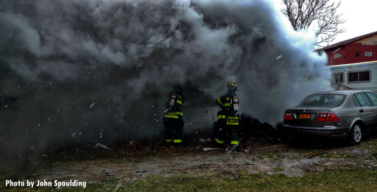 Smoke on the fireground as Rochester firefighters attempt fire suppression.