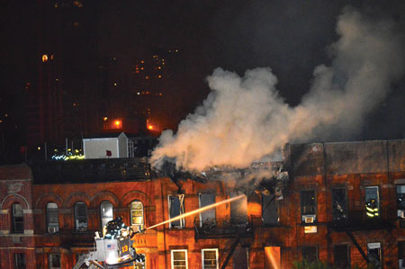 (5) A tower ladder operated because of the extremely large volume of fire in this building. 