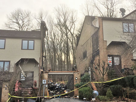 (3) This townhouse from the 1980s features a staggered roofline (to improve aesthetics) with masonry fire walls. A fire gutted the unit in the center; the concrete block fire walls on both sides contained the fire. 