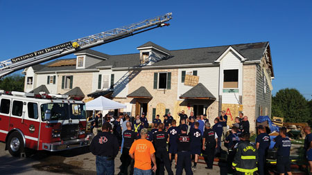 (1) The front exterior of townhouses used in full-scale scoping tests. <i>(Photos by ATF Fire Research Laboratory.) </i>