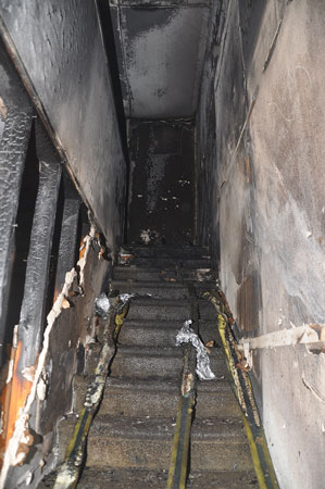 (5) The postfire interior stairway in full-scale scoping tests.