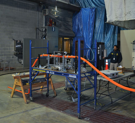 (6) The electric coil heater and platform used to stabilize hoseline in bench-scale laboratory testing. 