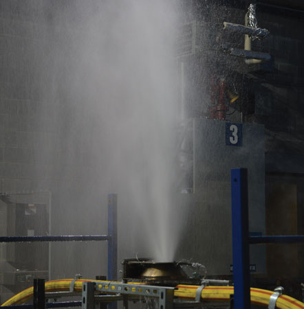 (8) Bench-scale testing of pressurized hose (water) just after thermal failure.