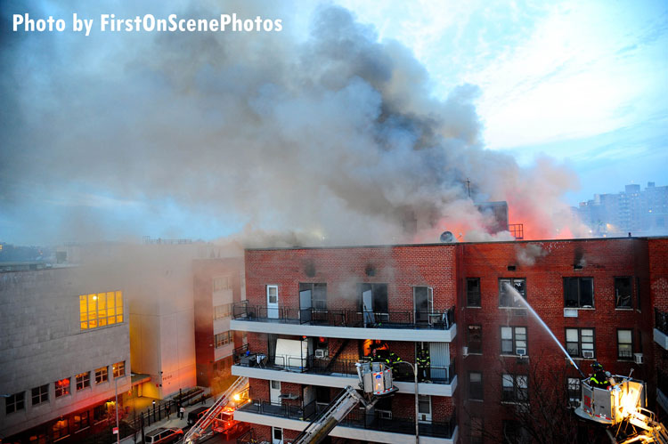 FDNY firefighters on scene at a major fire in a Queens apartment building