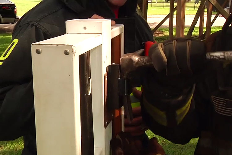 Firefighters perform forcible entry