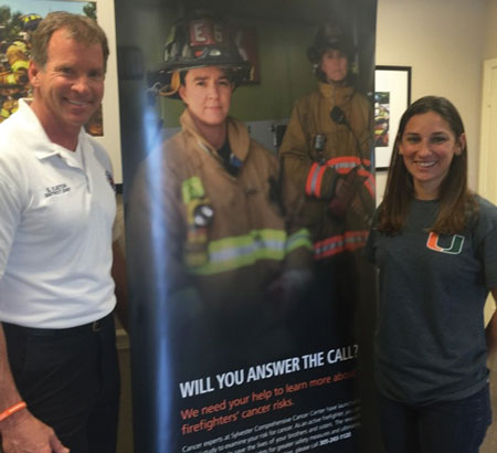 (7) PBC Firefighter Health Dr. Natasha Schaefer Solle, Sylvester Comprehensive Cancer Center, and Samuel A. Eaton, PBCFR battalion chief, when the new displays were delivered. (Photo courtesy of Tara Cardoso, public relations specialist, FFSHC FACE.) 