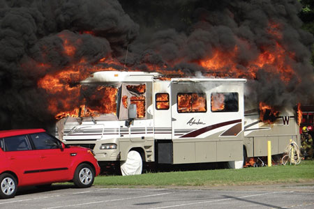 (11) A well-involved Class A puller type (motor in front) RV. Note the exposures.