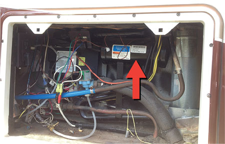 (6) The refrigerant tank (arrow) in an ammonia refrigeration system for a Class A type RV, which was typical before residential-style refrigerators became the standard.