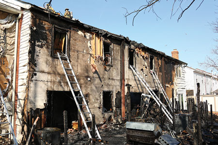 (1) For this response, units encountered heavy fire on arrival from side C involving multiple townhouses. Crews’ 360° size-up and initial fire attack were hampered by fire and privacy fences. <i>[Photos by Rayford Smith, Virginia Beach (VA) Fire Department Multi-Media Division.] </i>