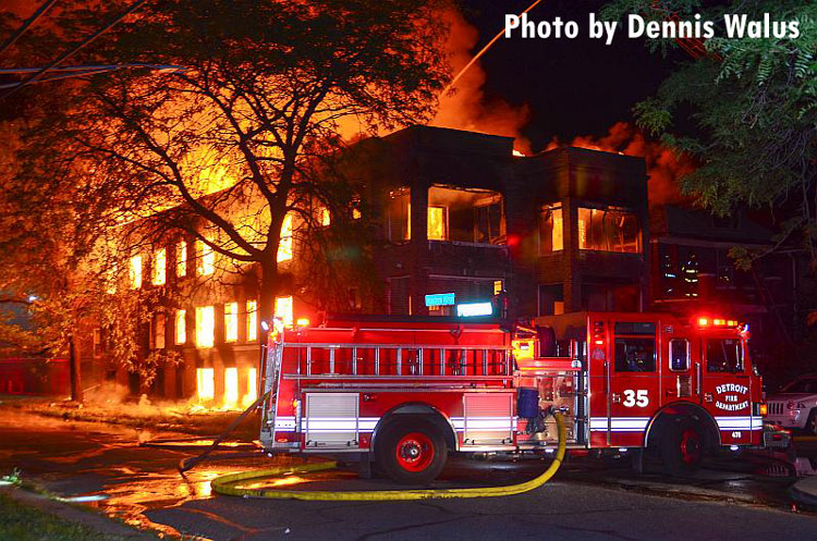 Detroit fire apparatus in front of a burning building