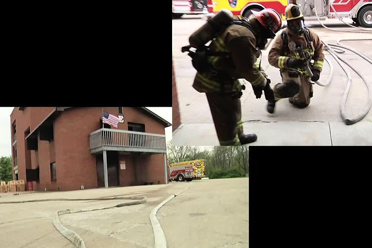 Firefighters mask up and advance two hoselines for fire attack