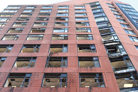 (3) A view from Jones Street looking up at the Quorum the day after the fire. Glass from the high-rise had to be removed before the street was opened.