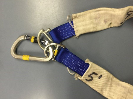 (3) The anchor strap is wrapped around a structural member and connected with a carabiner. 