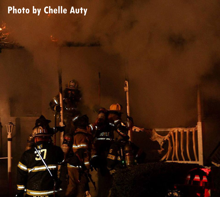 Firefighters on scene of a fatal house fire