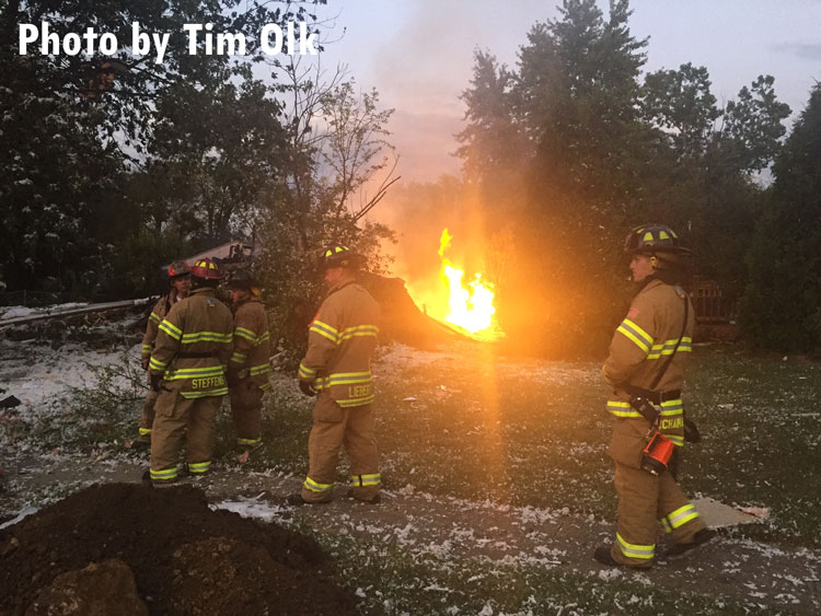 Firefighters outside the scene of a home explosion in Gurnee, Illinois.