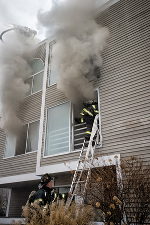 (3) Members advance a handline from an exterior enclosed space to attempt to get water on the fire.