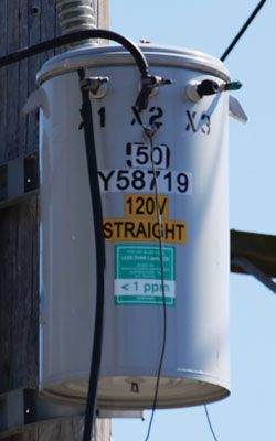 (2) This is a reconditioned pole-mounted transformer. Notice the label indicating less than one part per million of PCBs.