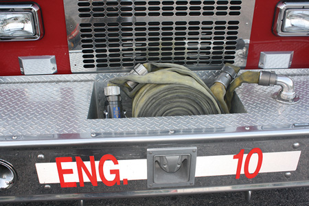 (1) View of the line packed in the hose well of the front bumper. <i>(Photos by author.) </i>