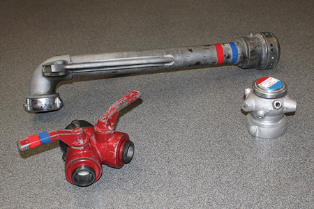 (3) Get the seldom-used appliances out of the compartments and train with them. The time to refamiliarize yourself with them is not when you need them at a fire. Pictured here are two types of cellar nozzles (or Bresnan distributor nozzles, background and right) and a gated wye (left).