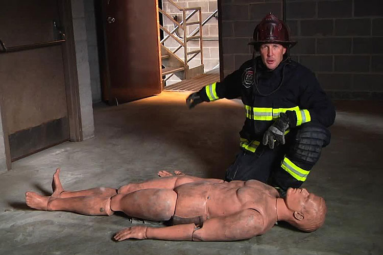 Sean Gray and a training manikin