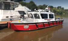 Lake Assault’s 34-FOOT FIREBOAT is now on duty with the Pittsburgh (PA) Bureau of Fire. The craft is a deep V-hull configuration powered by twin V-6 outboard motors and is capable of a top speed greater than 40 mph. The firefighting system features a compact Hale pump flowing up to 3,000 gpm that is powered by a dedicated V-8 diesel engine. The fire pump includes a six-inch main discharge that feeds a number of outlets including bow and stern mounted monitors. The craft also features a full spectrum of Garmin electronics, all controlled through 12- and 16-inch touchscreens. www.lakeassaultboats.com. (715) 395-2255. To request information go to fireeng.hotims.com