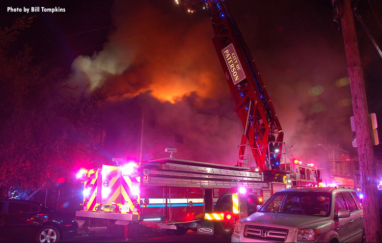 Fire trucks at scene of Paterson house fire