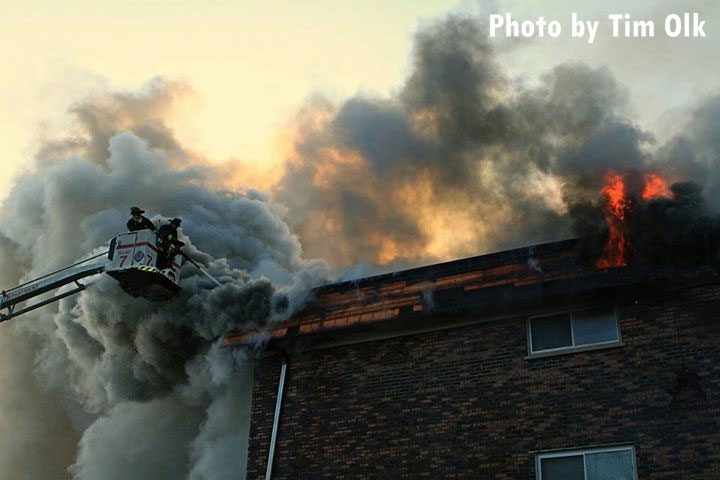 Chicago firefighters in Squad 7 bucket working at fatal apartment fire