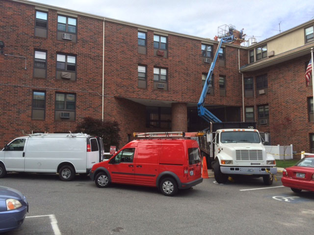 Vehicles block access to a building