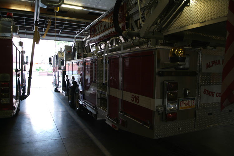 Fire truck in an apparatus bay