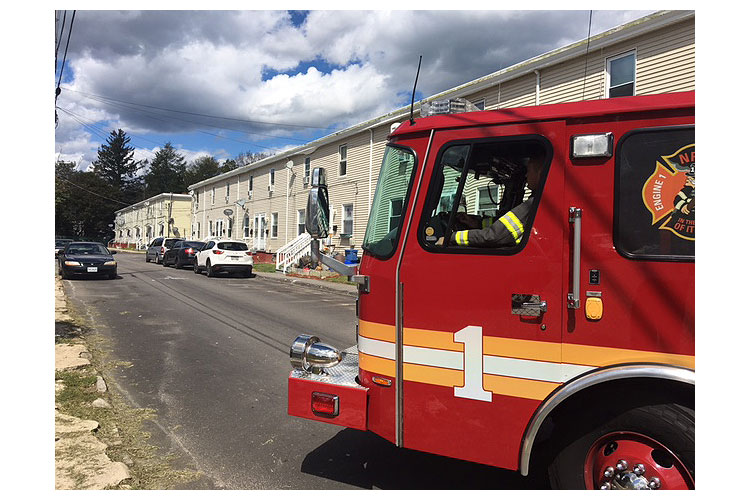 Fire apparatus and firefighters on a residential block