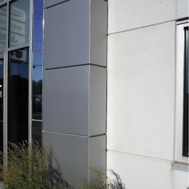 (1) An aluminum composite panel may be formed into any shape vertically and gives a modern look to new buildings or revitalizes older structures. This close-up image shows the shiny panel installed at the entrance of an auto dealership. (Photo by Greg Havel.)