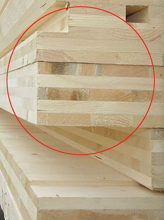 (1) A cross-laminated timber stack used as open span flooring. The circle indicates a single section. (Photo by author.)