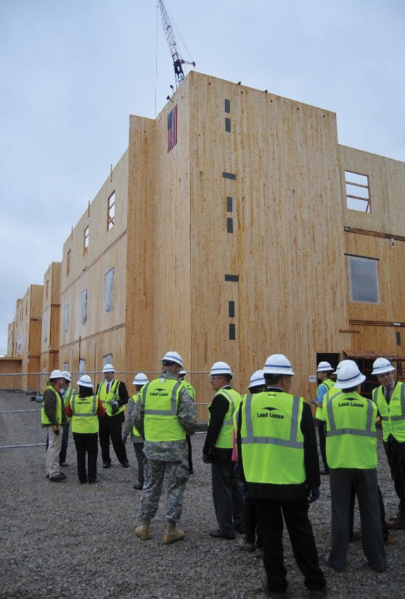 (2) Floor or wall sections can be made as big as needed or can be practically transported, as was done for this five-story U.S. Army accommodation block built in Alabama. Each floor section measures 8 feet × 50 feet and weighs 8,000 pounds. The stairwell walls are just over 37 feet tall and weigh 3,700 pounds. (Photo courtesy of Redstone Rocket.) 