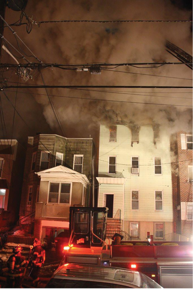 (1) How can we possibly use a two-person stretch to get water on these two fires? They must be “all-hands” stretches in which as many personnel as are available are enlisted to get the first line in service and operating on the fire. (Photos by Ron Jeffers.)